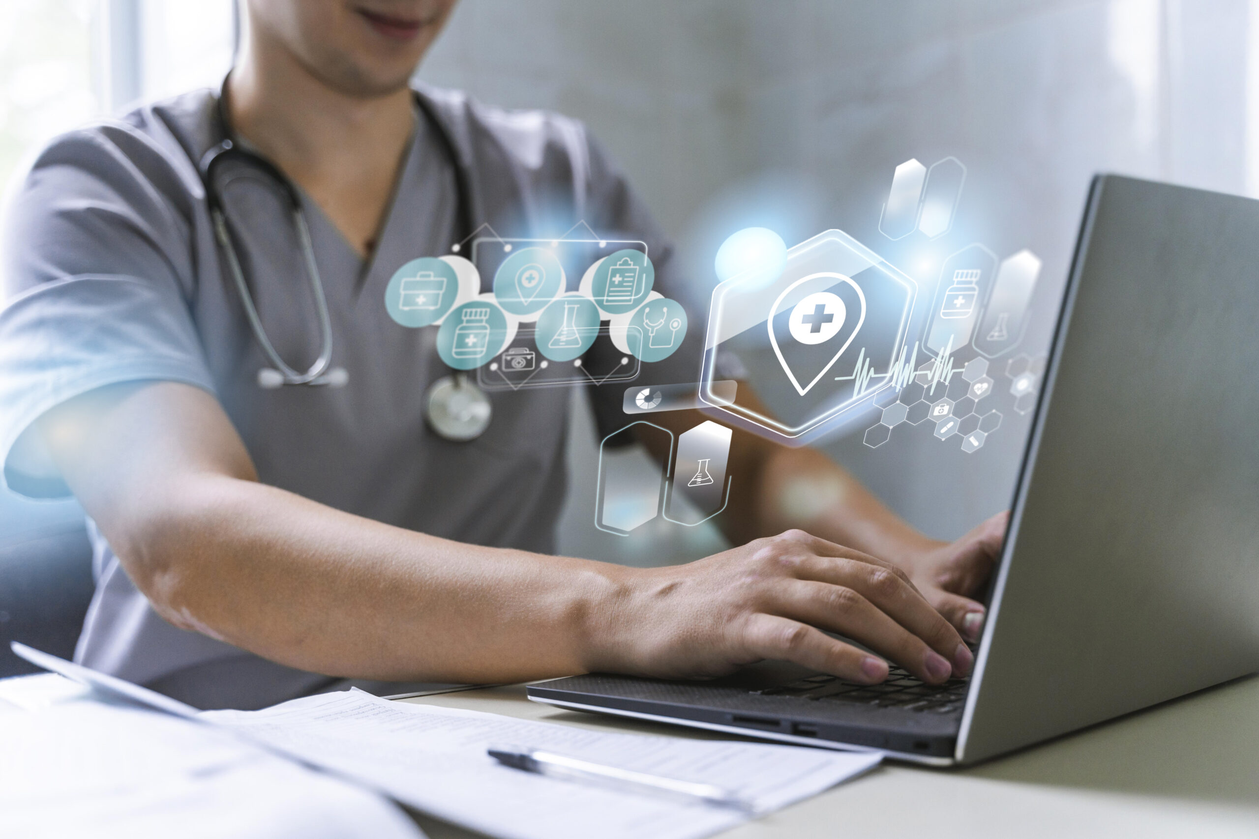 A doctor using a laptop - Stevens Law Group